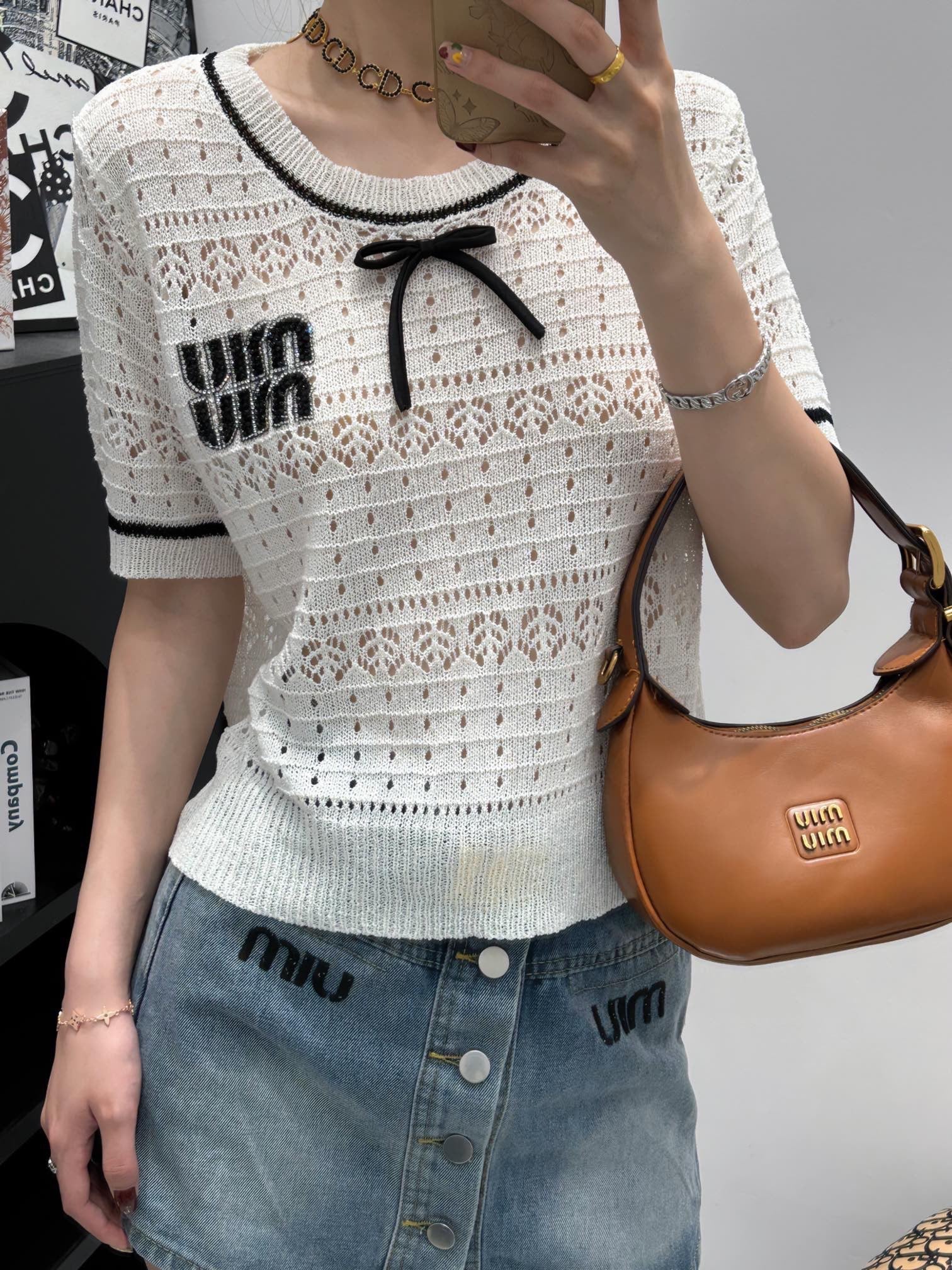 Rhinestone embellished knit short-sleeve top.